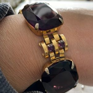 This is a beautiful antique bracelet the stone are glass purple
